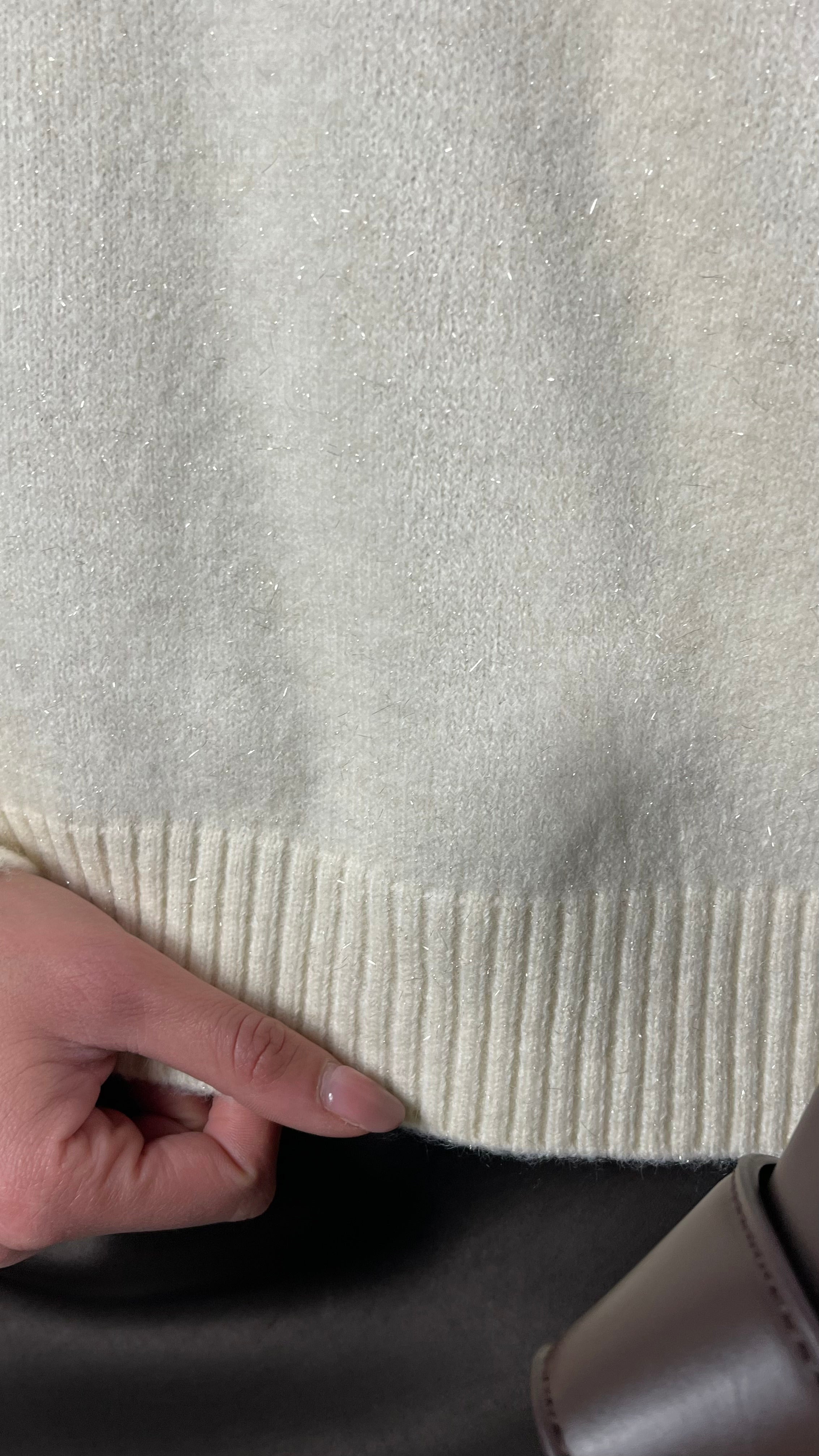 Maglione con treccia sulla spalla