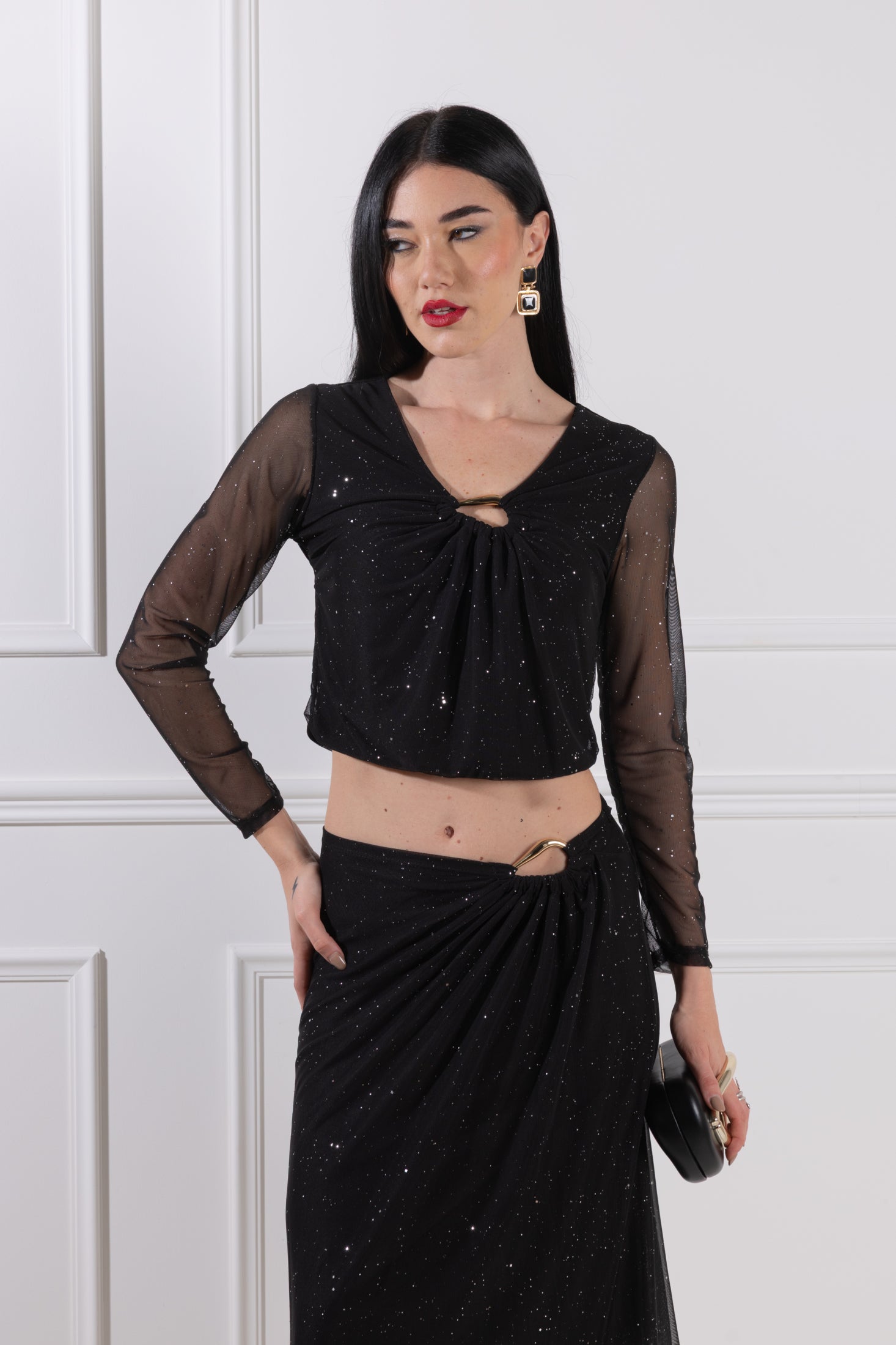 Blusa con accessorio a goccia