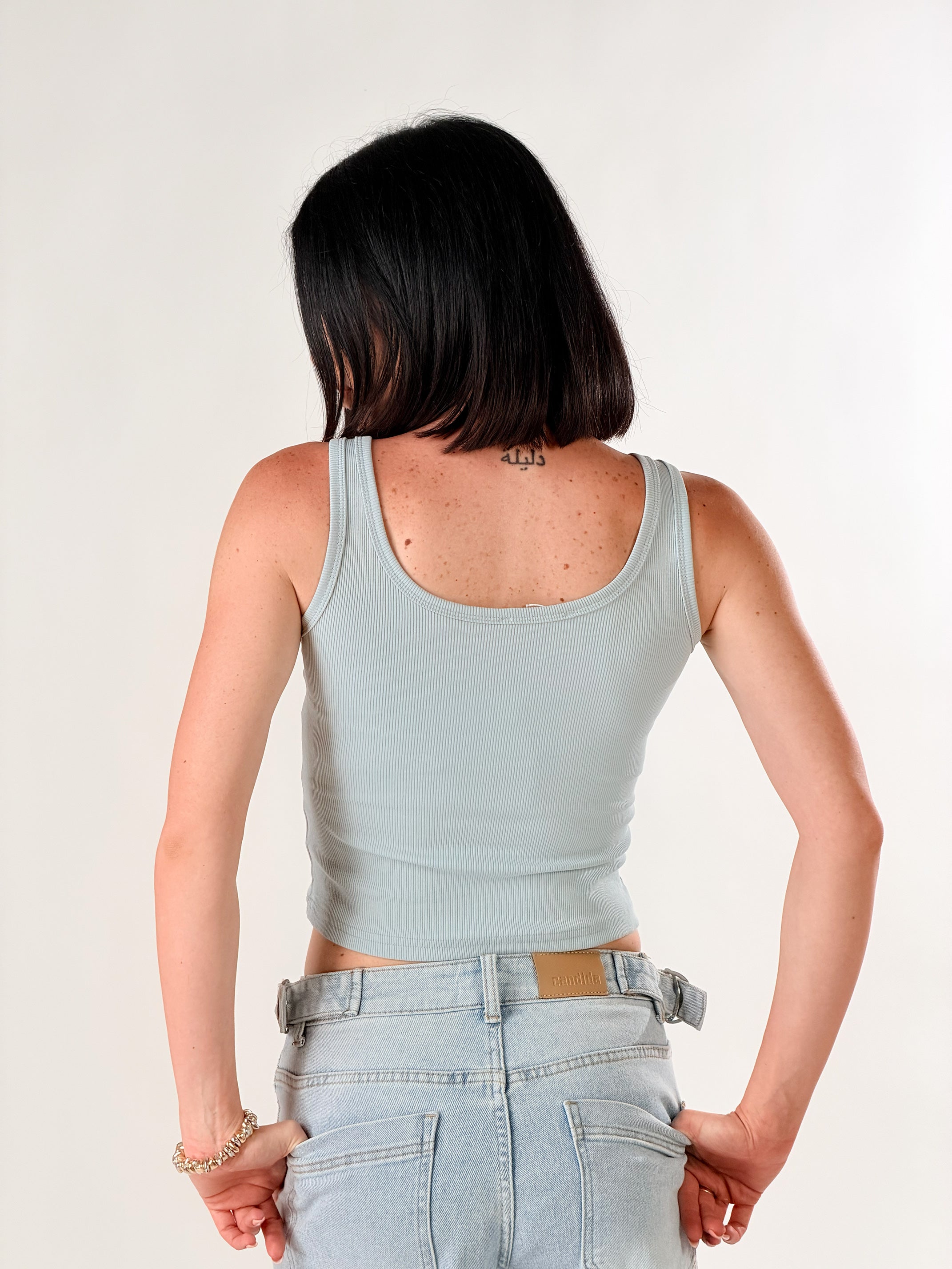 Top con fibbie|Colore:Celeste