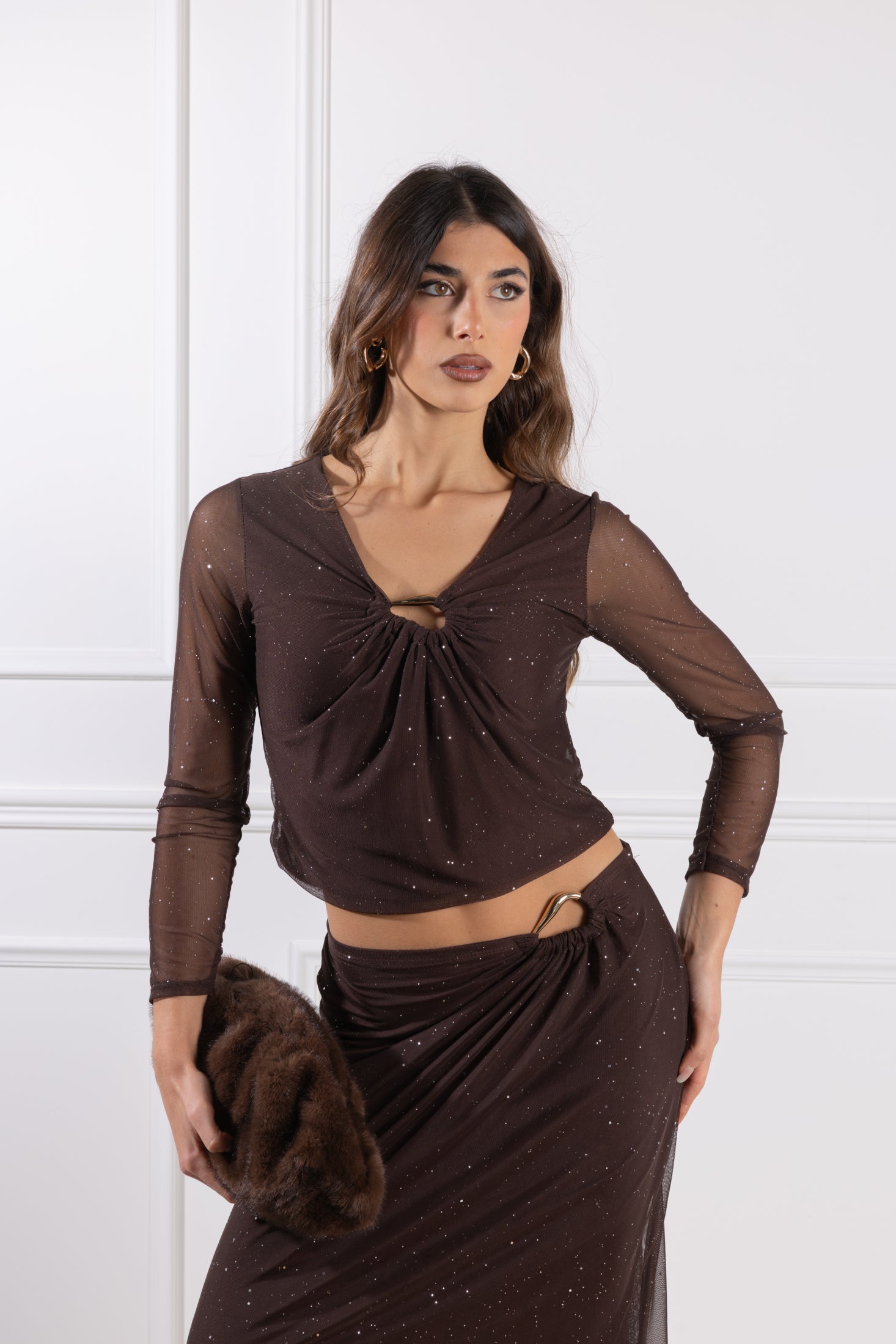 Blusa con accessorio a goccia