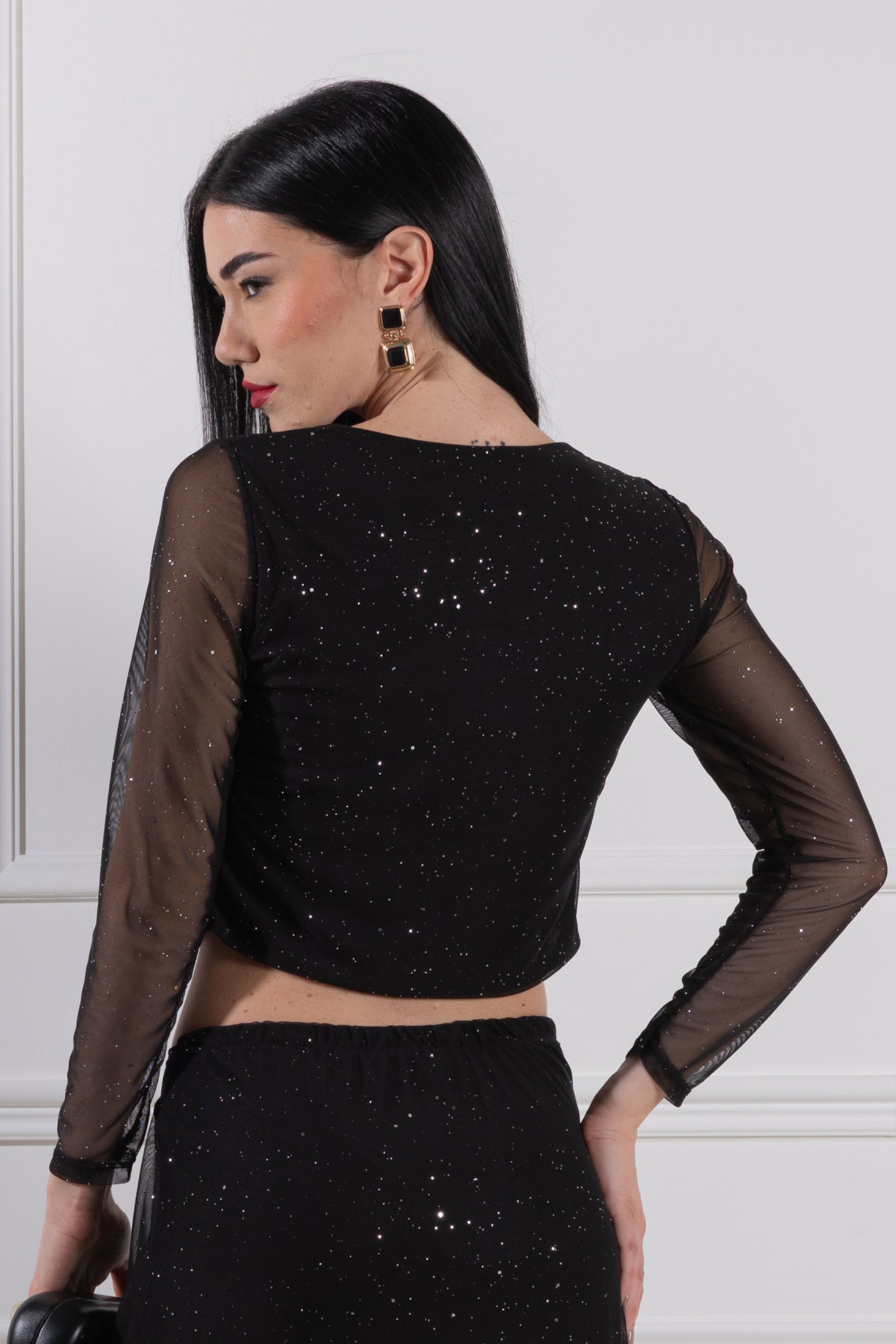 Blusa con accessorio a goccia